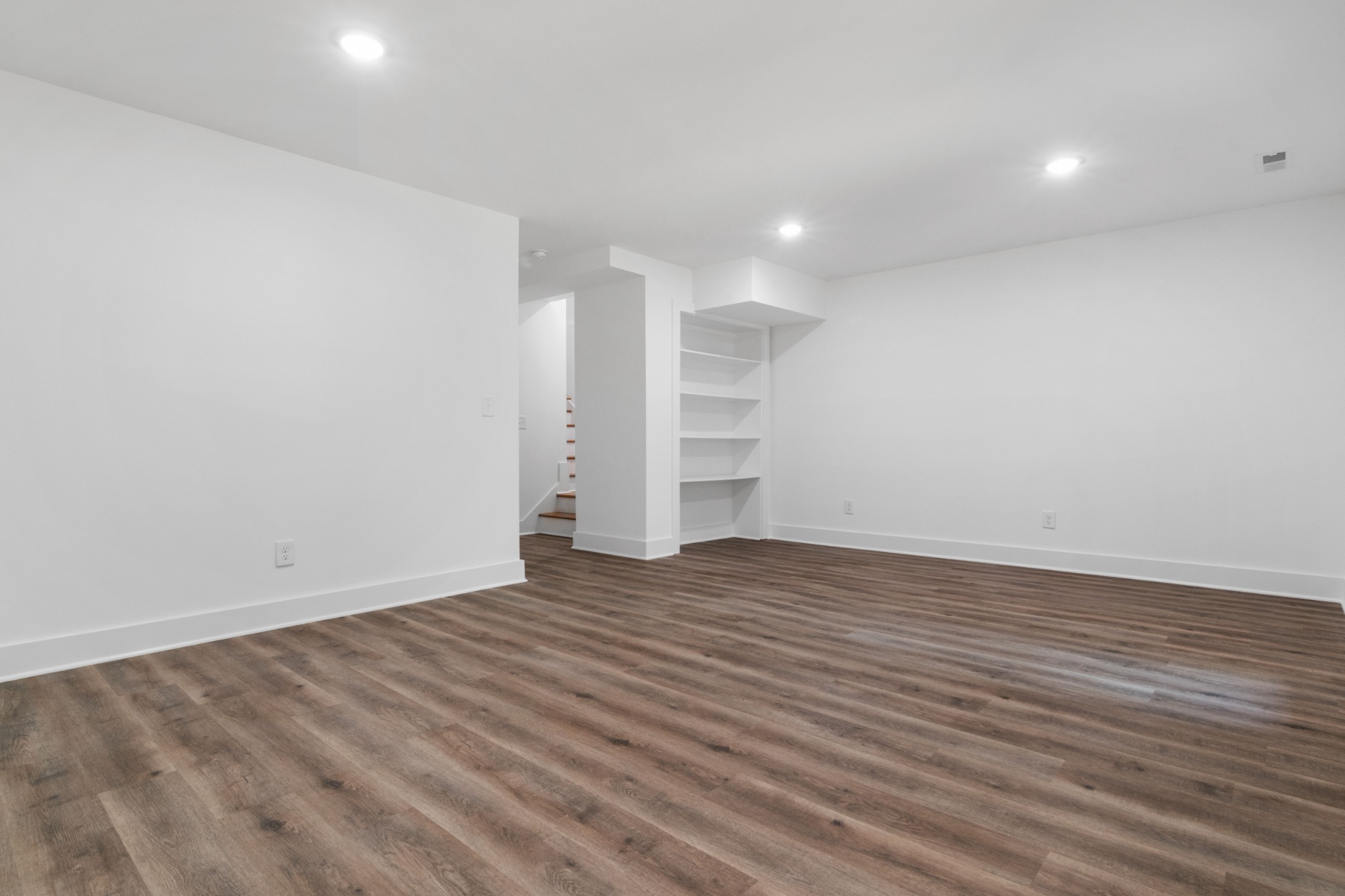 Empty apartment interior with clean floors, ready for a property refresh